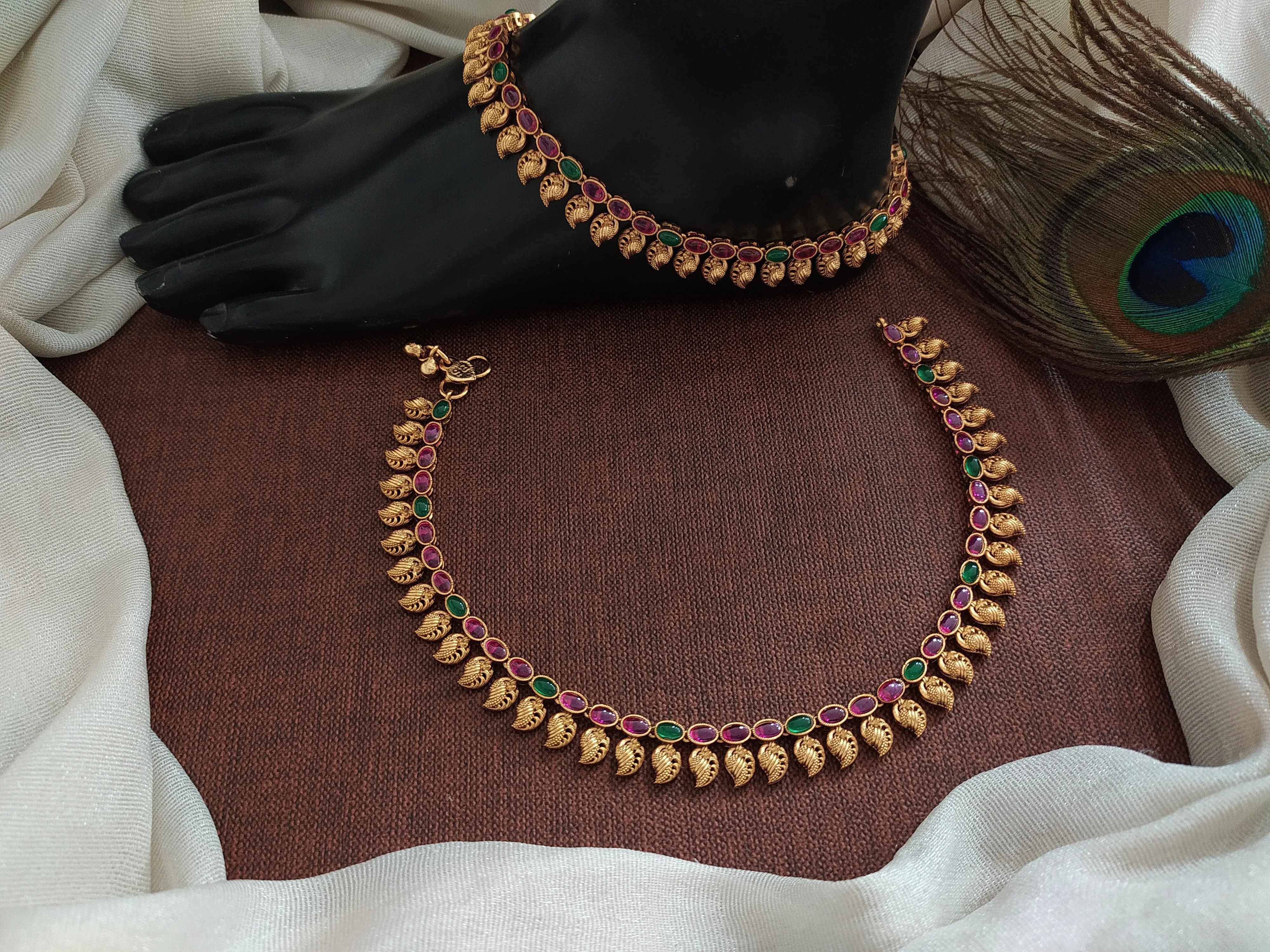 "Classic Beauty: Oval Kemp & Green Stone Anklets with Mango Details"