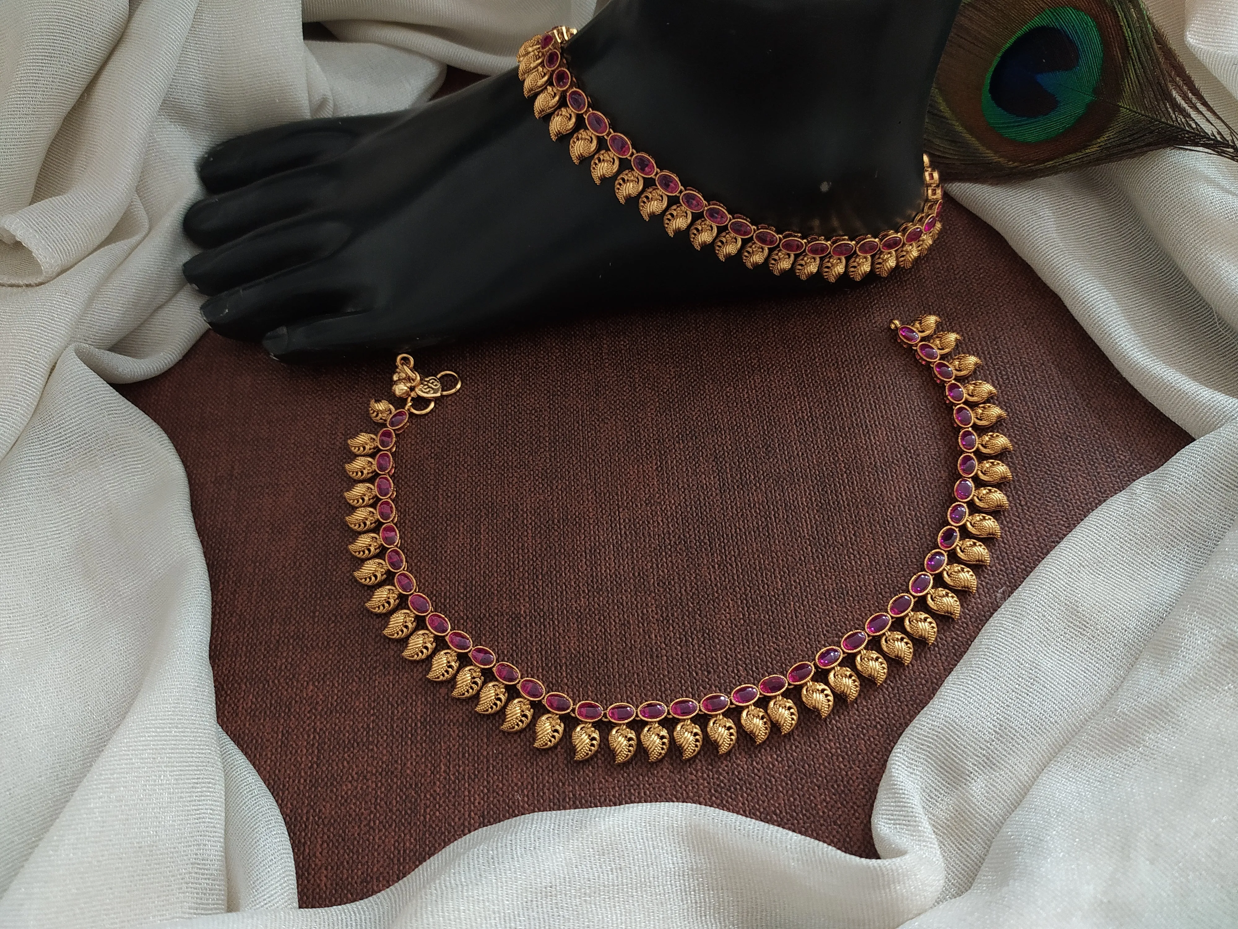 "Classic Beauty: Oval Kemp & Green Stone Anklets with Mango Details"
