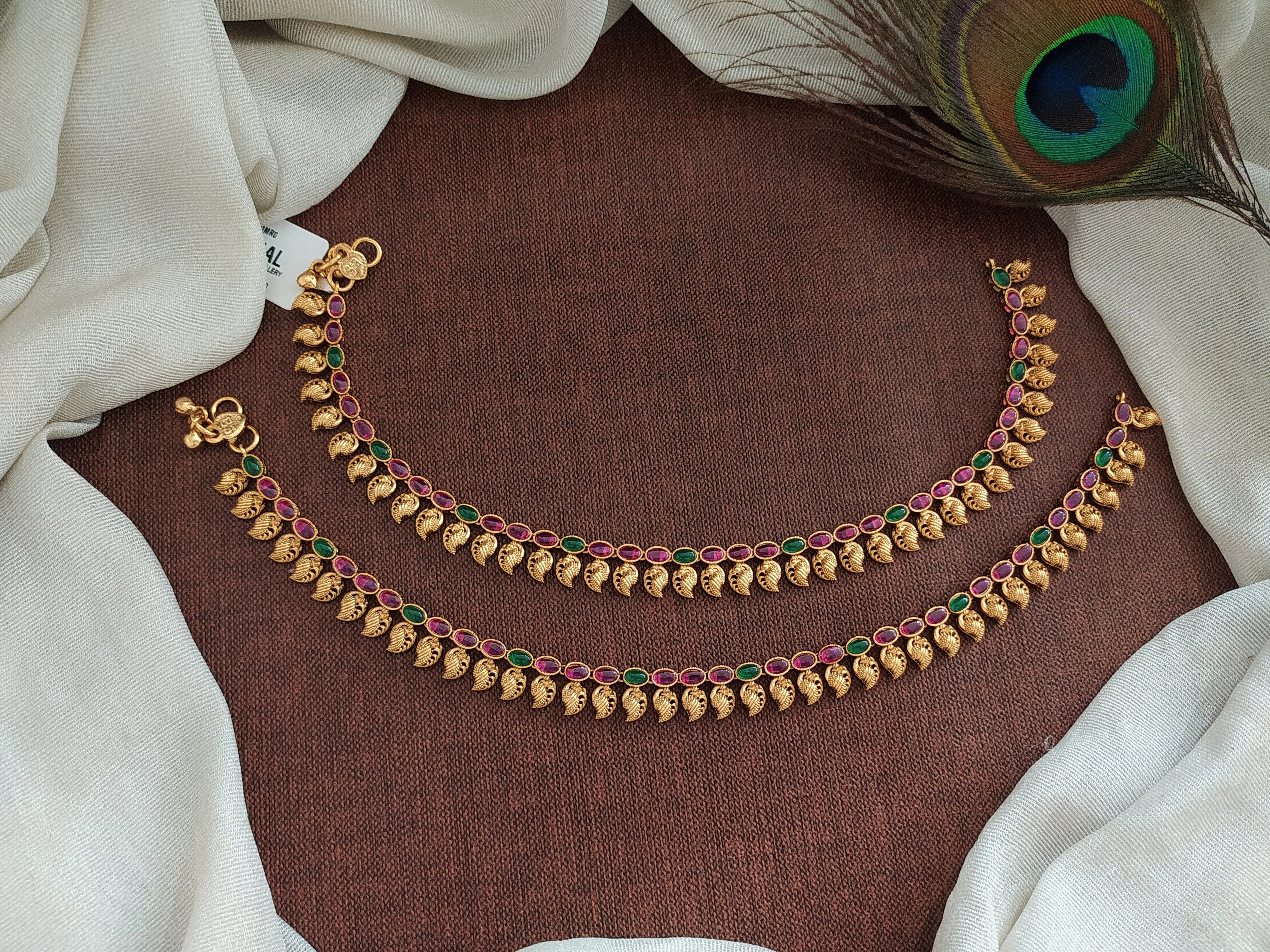 "Classic Beauty: Oval Kemp & Green Stone Anklets with Mango Details"