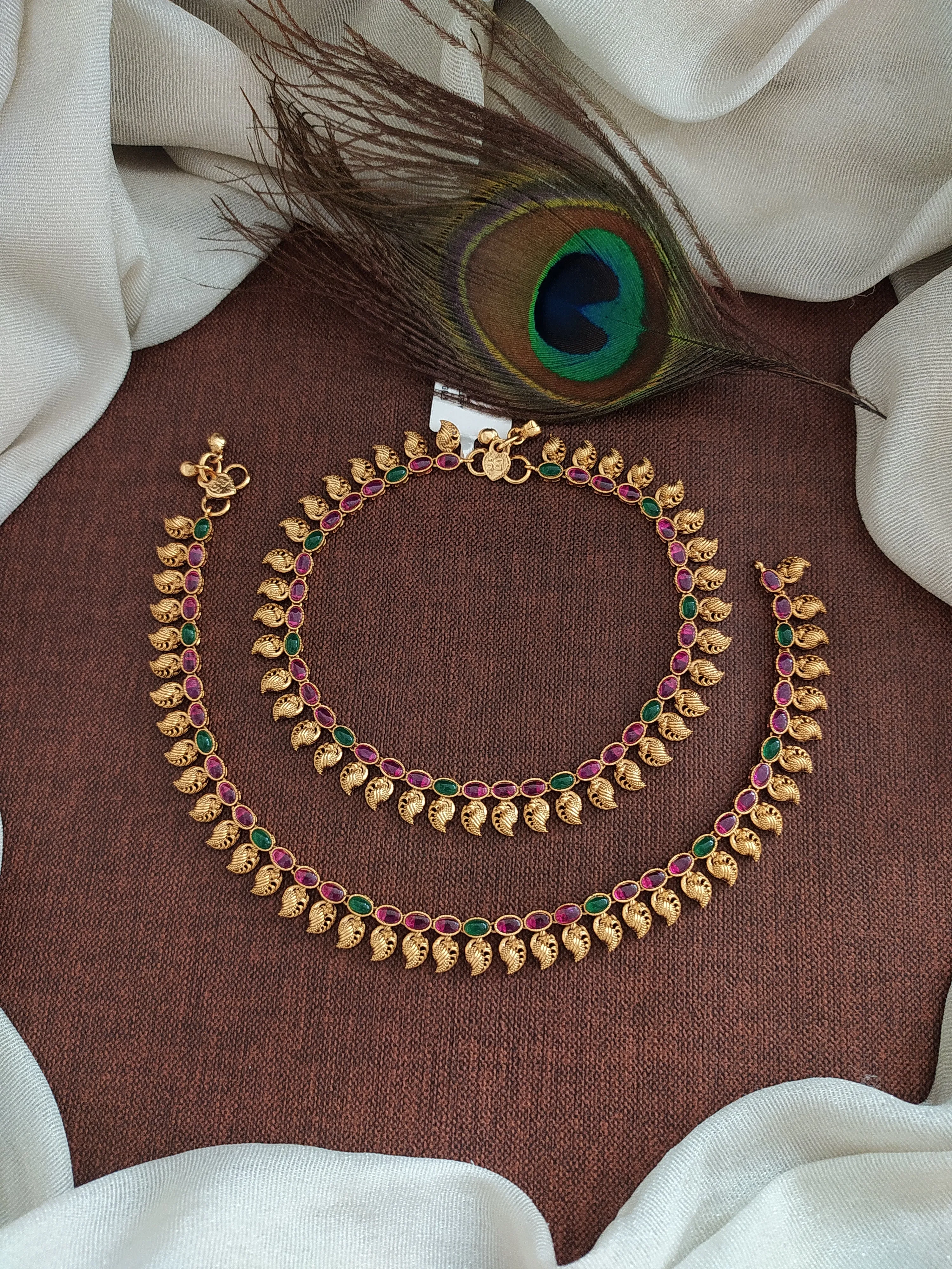 "Classic Beauty: Oval Kemp & Green Stone Anklets with Mango Details"